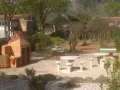 Outdoor picnic area with a barbecue and stone tables, perfect for enjoying a meal in Saint-Maximin-la-Sainte-Baume.