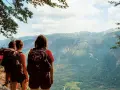 Hikers pause on a pyrenees trail, taking in the breathtaking mountain vista.