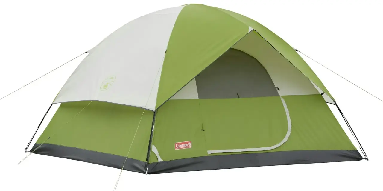 A green and white Coleman Sundome 4 person tent, ready for adventure. Learn about its dimensions for your next camping trip.