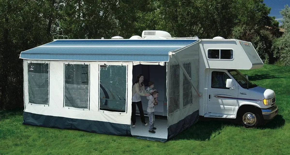 Family enjoys dewinterizing camper, setting up the awning and preparing for adventures.