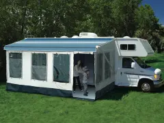Family enjoys dewinterizing camper, setting up the awning and preparing for adventures.