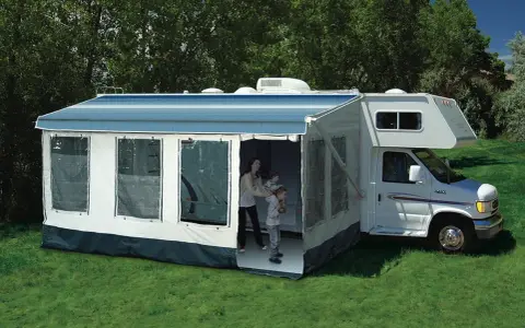 Family enjoys dewinterizing camper, setting up the awning and preparing for adventures.
