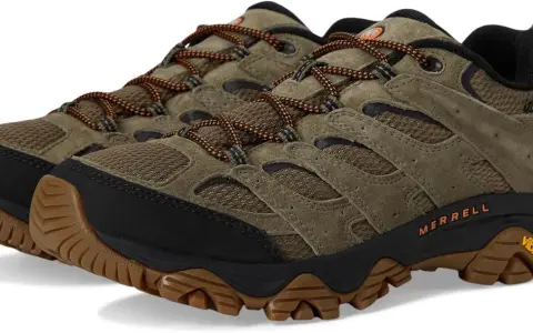 A pair of olive green Merrell Moab 3 waterproof hiking shoes with orange laces and Vibram soles.