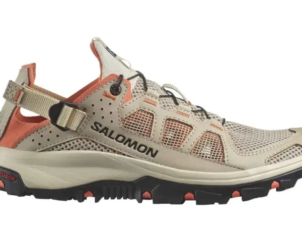 A beige and orange Salomon Techamphibian 5 sandal-shoe hybrid with a mesh upper and Contagrip sole, perfect for amphibious adventures.