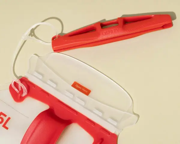 An Osprey 2.5L hydration pack with a red bite valve and a clear opening. This hydration pack is perfect for staying hydrated on the go.