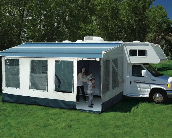 Family enjoys dewinterizing camper, setting up the awning and preparing for adventures.