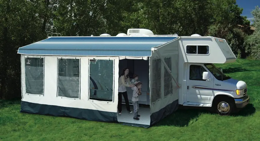Family enjoys dewinterizing camper, setting up the awning and preparing for adventures.