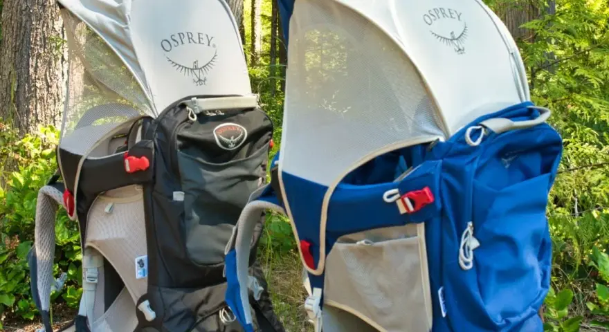 Two Osprey Poco Plus child carriers in black and blue, ready for adventure. Check the Osprey Poco Plus weight limit for safe hiking.
