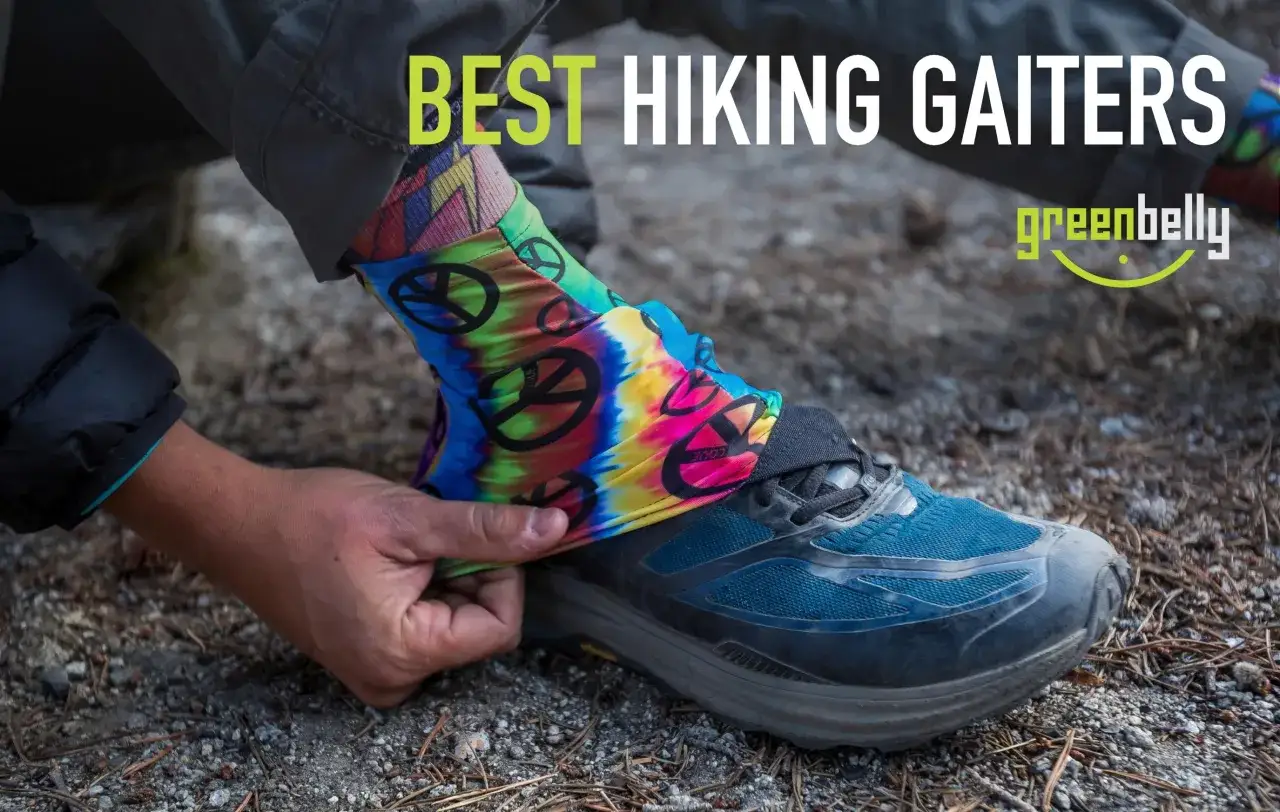 Colorful gaiters with peace signs are pulled onto a hiking shoe, protecting feet from debris.