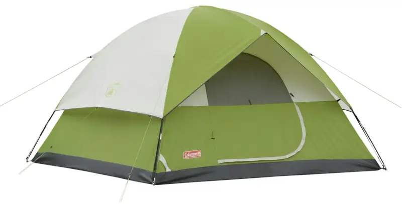 A green and white Coleman Sundome 4 person tent, ready for adventure. Learn about its dimensions for your next camping trip.